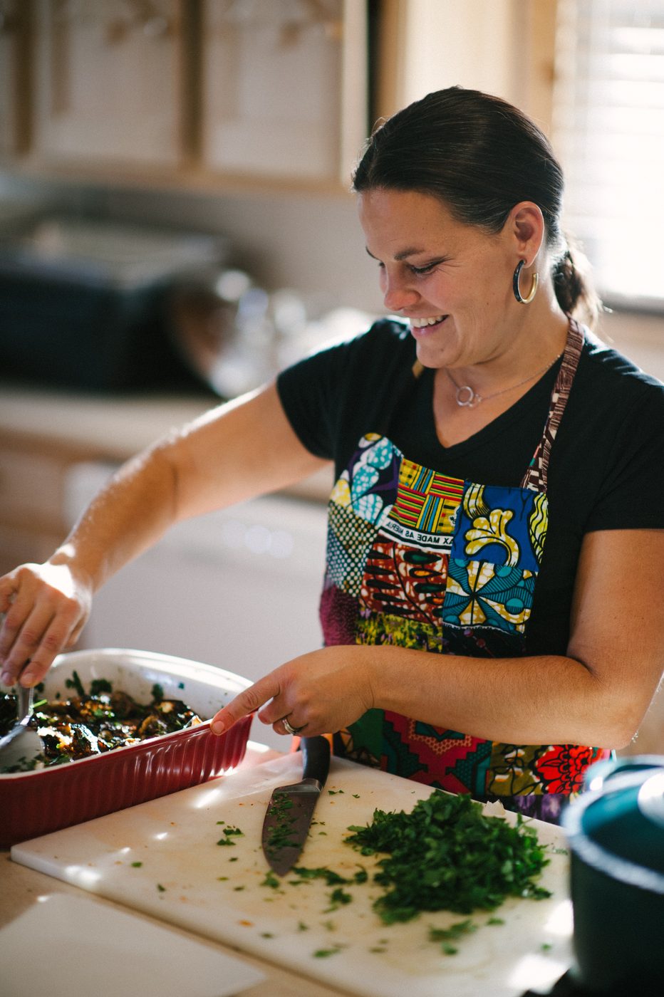 Gwen chopping fresh herbs