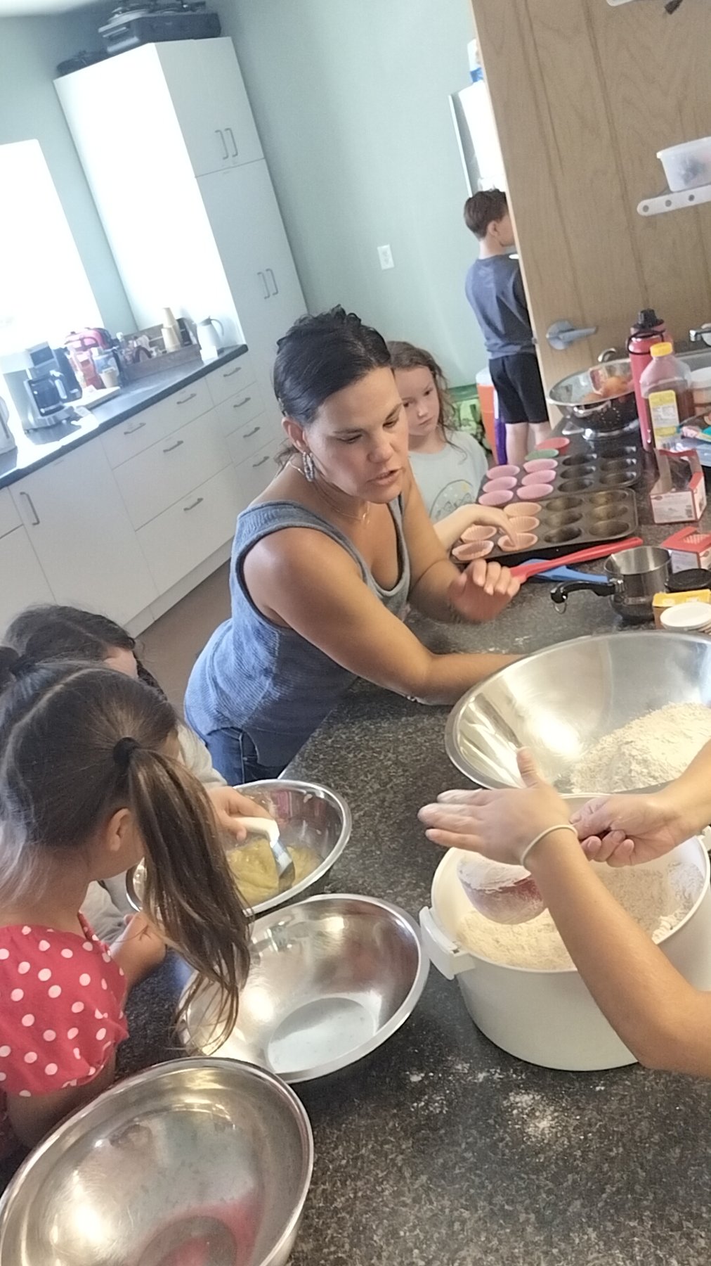 Kids learning to bake and cook together in a Nutrition Explorers class
